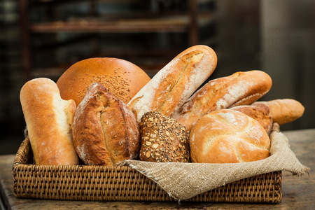 Fresh crunchy bread assortment in a cozy wicker basket