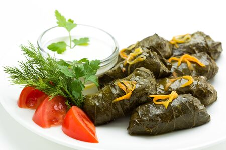 Traditional georgian dolma in grape leaves close up. Stuffed grape leaves with rice and meatの写真素材