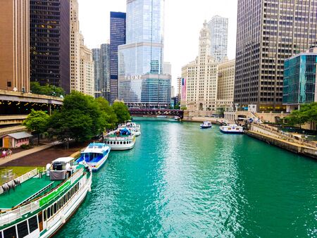 Chicago, Illinois, USA. 07 05 2018. Trump Tower, Wrigley building with large flag, river waterfront. 4th July week.のeditorial素材