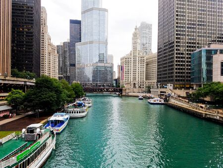 Chicago, Illinois, USA. 07 05 2018. Trump Tower, Wrigley building with large flag, river waterfront. 4th July week.のeditorial素材