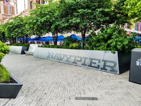 Chicago, Illinois, USA. 07 06 2018. Navy pier sign near green trees. Summer. Daylight.のeditorial素材