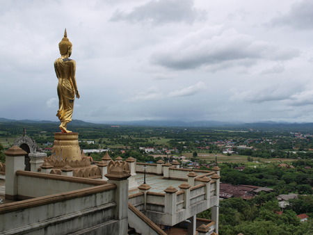 Buddha standing on a mountain, Nan Province of Thailand.の写真素材