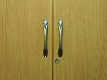 wooden oak wardrobe door two handles closeupの写真素材