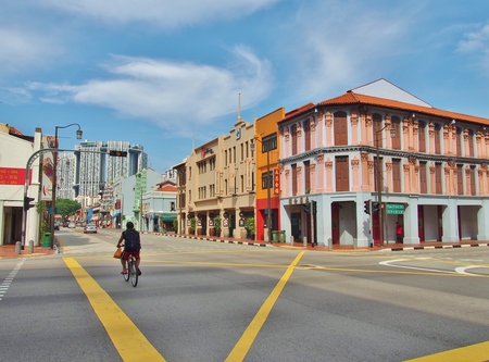 The cyclist at junction of South Bridge Road with Upper Cross Street Street scene in Chinatown Singapore.のeditorial素材