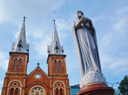HO CHI MINH CITY VIETNAM  NOVEMBER 29: Virgin Mary statue and NotreDame Cathedral landmark in Ho Chi Minh City Vietnam on November 29 2013. The cathedral is a very famous building in HCMC.のeditorial素材