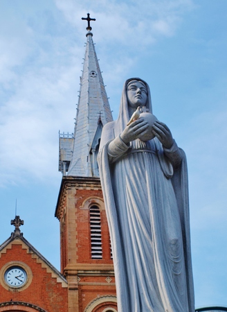 HO CHI MINH CITY VIETNAM  NOVEMBER 29: Virgin Mary statue in front of NotreDame Cathedral landmark in Ho Chi Minh City Vietnam on November 29 2013. The cathedral is very famous building in HCMC.のeditorial素材