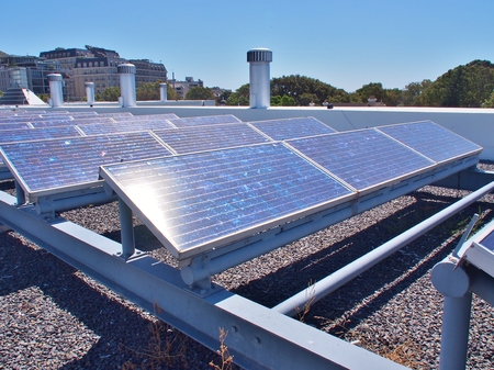 Solar panels or Solar cells on rooftop or terrace of building in Cape Town, South Africa. Can saving...