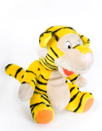 toy tiger yellow in turn black strip on white backgroundの写真素材