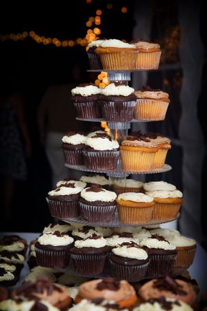 a bunch of wedding cupcakes. Many people choose cupcakes over the traditional cakeの写真素材