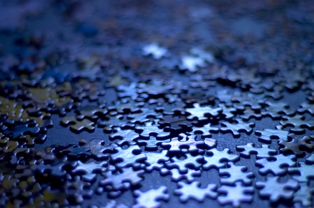 blue puzzle pieces very shallow depth of field, good background image or concept (confusion, indecision)の写真素材