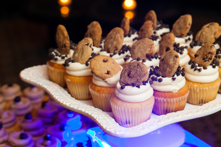 wedding cupcakes with chocolate chips and cookies during a catered eventの写真素材