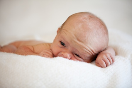 Cute Baby Boy on White Blanketの写真素材