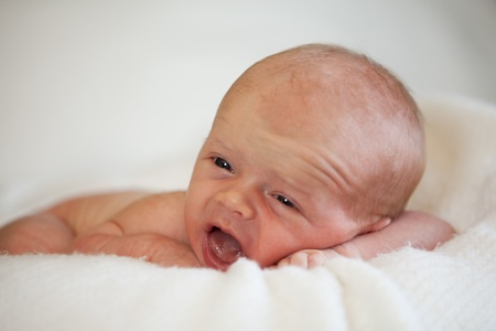 Cute Baby Boy on White Blanketの写真素材