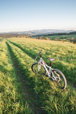 A pathway and a bicycle in Bieszczady Mountainsの写真素材