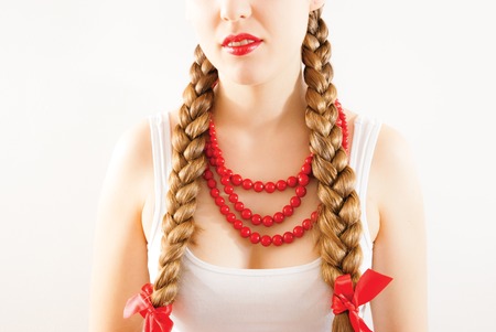 A young woman with long blonde tressesの写真素材