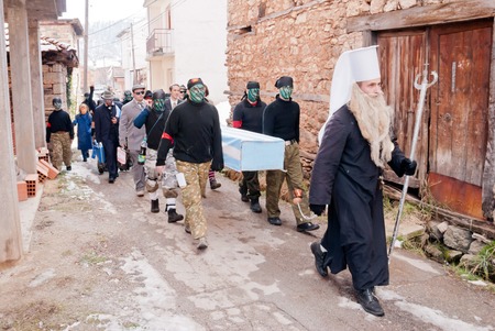 VEVCANI, MACEDONIA - JANUARY 13, 2012: A group of disguised participants celebrate the symbolic...