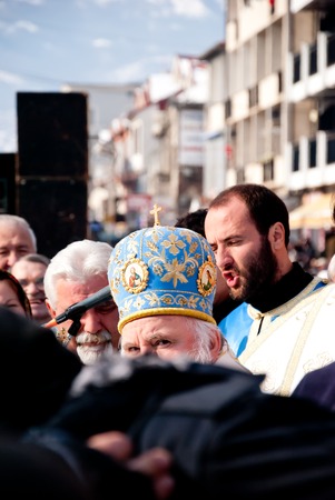 STRUGA, MACEDONIA - JANUARY 19, 2012: An orthodox priest during the Epiphany (Vodici, Bogojavlenje,...