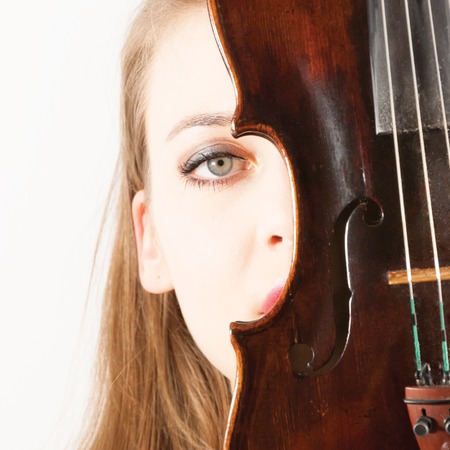 A young beautiful woman with a violinの写真素材