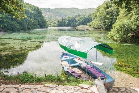 Springs and a boat in Sveti Naum, Macedoniaの写真素材