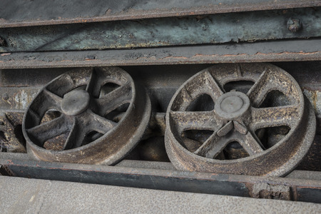 Wheels of a small wagon in a coalmine.の写真素材