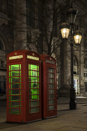 Old phonebox in a night street.の写真素材