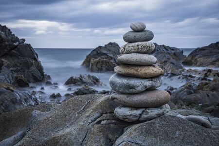 Stacked pebbles on the scottish coast.