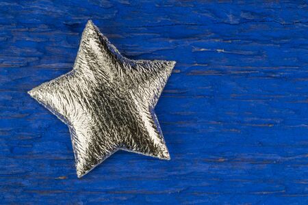 Silver star on blue background