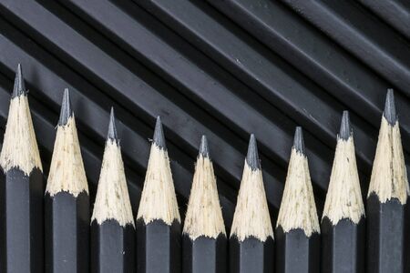 Black pencils lined together close upの写真素材