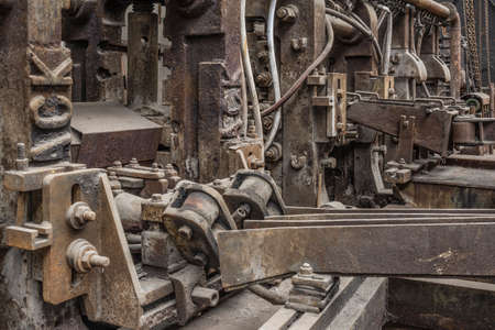 Old rusty steel rolling machinery.の写真素材