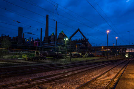 historic steelworks at night