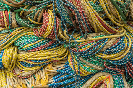 a pile of fishing ropes on a pier
