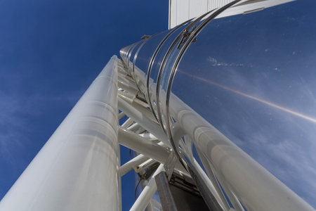 stainless steel chimney on an industrial buildingの写真素材