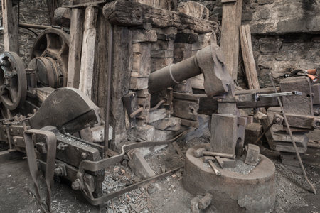 Historic machinery in a blacksmiths workshop.
