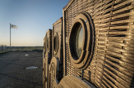 Wicker beach chairs on an evening beach.の写真素材