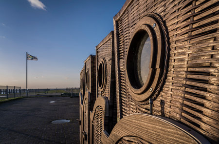 Wicker beach chairs on an evening beach.の写真素材