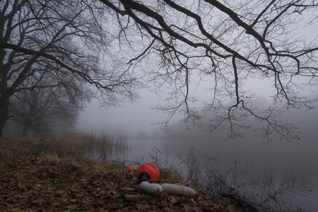 A foggy day on a rural lake.の写真素材