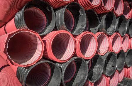 Stack of drain water hoses on a construction site