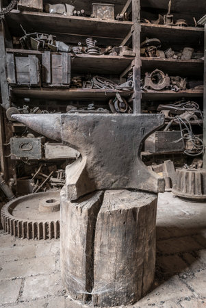 Historic anvil in a abandoned workshop.の写真素材