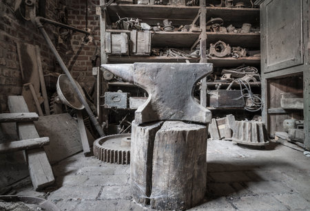 Historic anvil in a abandoned workshop.の写真素材