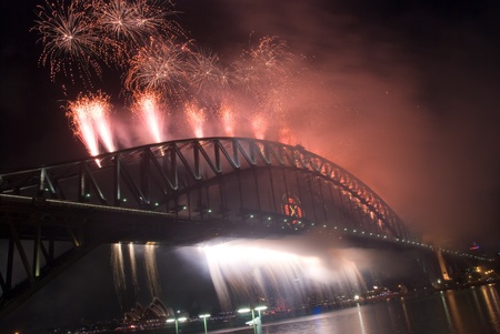 Sparkling New Year Eve nye Fireworks in Sydney Harbour Sky Line At Night, NSW, Australia, Oceania. The Sydney harbour bridge and sydney opera house sparkling in the night. Colourful surface. Night sceneのeditorial素材