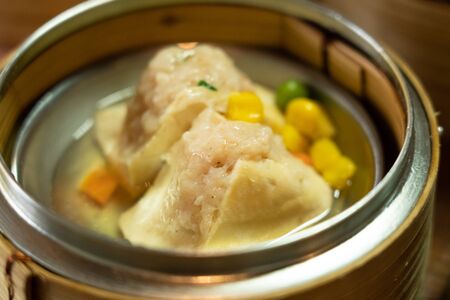 Various thai Dim Sam on the table in morning lightの写真素材