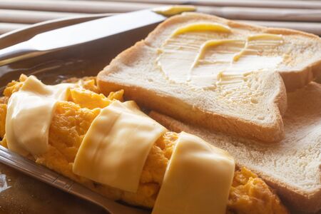 butter spread on sliced bread in close up top viewの写真素材