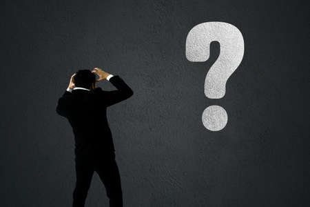 businessman disappoint with business decline impacted from coronavirus, economy crisis conceptの写真素材