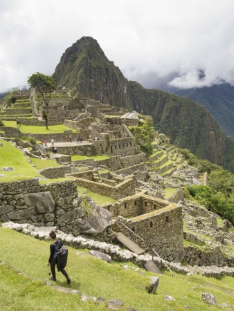 CUSCO, PERU - MAR 15:  Tourists visit a pre-Columbian 15th-century Inca site of Machu Picchu after rain on Mar 15, 2011 in Machupicchu District, Urubamba Province, Cusco Region, Peru.のeditorial素材