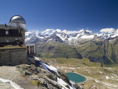 ZERMATT - JUN 27: Gornergrat Observatory surrounded by the Pennine Alps on Jun 27, 2011 in Zermatt, Switzerland. It can be reached by Gornergrat rack railway, the highest open-air railway in Europe.のeditorial素材