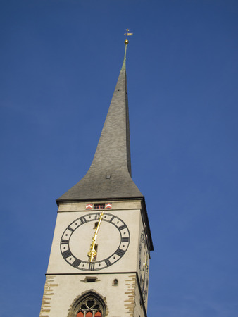 Clock tower of St Martin Church in Chur Coire  city on the right shore of the Rhine-River and is...