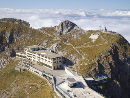 ALPNACHSTAD, SWITZERLAND - OCT 26, 2011  Hotel Pilatus-Kulm, viewed from summit of Esel on Mt  Pilatus  This historical hotel at altitude 2132 m  was erected in 1890 and completely renovated in 2010 のeditorial素材