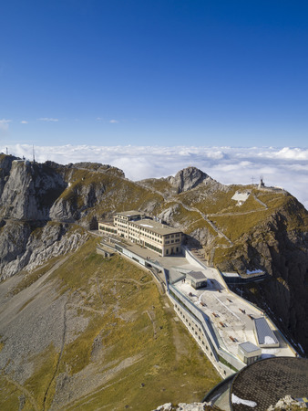 ALPNACHSTAD, SWITZERLAND - OCT 26, 2011  Hotel Pilatus-Kulm, viewed from summit of Esel on Mt  Pilatus  This historical hotel at altitude 2132 m  was erected in 1890 and completely renovated in 2010 のeditorial素材