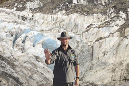 WEST COAST, NZ -MAY 20: Warning sign as Park Ranger in stop action to warning visitors do not pass to the forbidden area at Fox Glacier terminal face on May 20, 2013 in West Coast, New Zealand.のeditorial素材