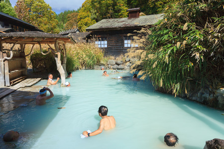AKITA, JAPAN -OCT 20, 2012: People soaking in outdoor hot spring pool at Tsurunoyu onsen. Tsurunoyu...